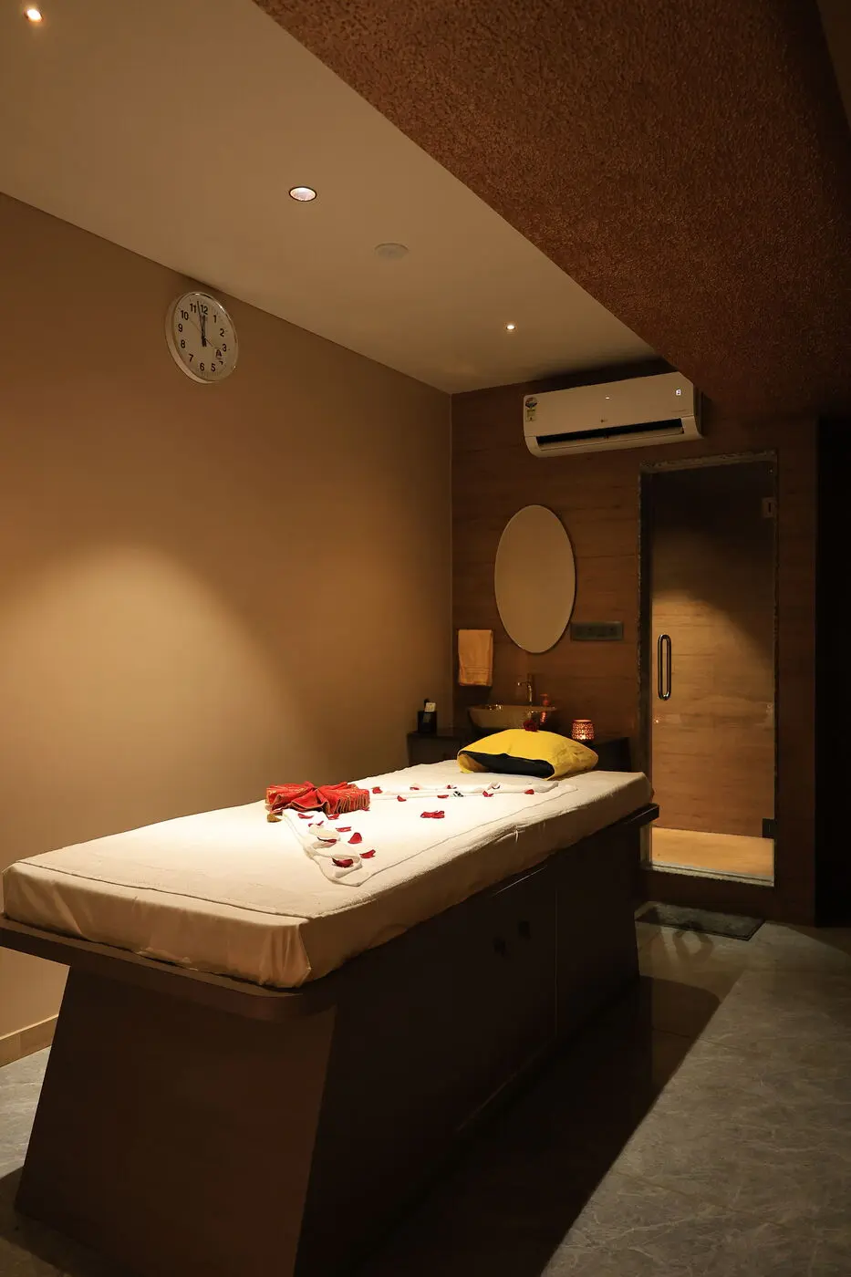 Massage room with attached glass steam cabin